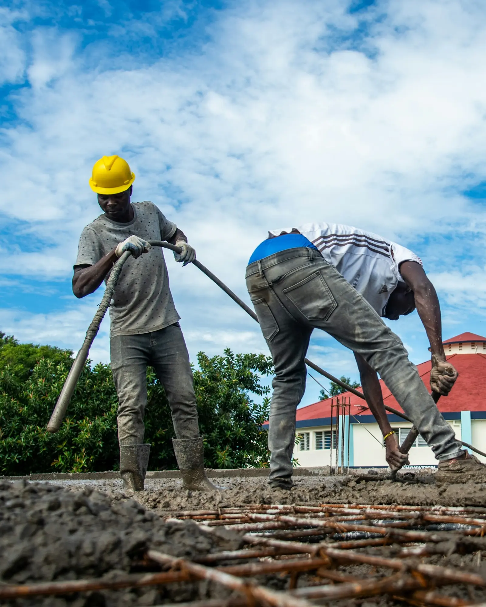 Representative Unsplash construction workers completing concrete works